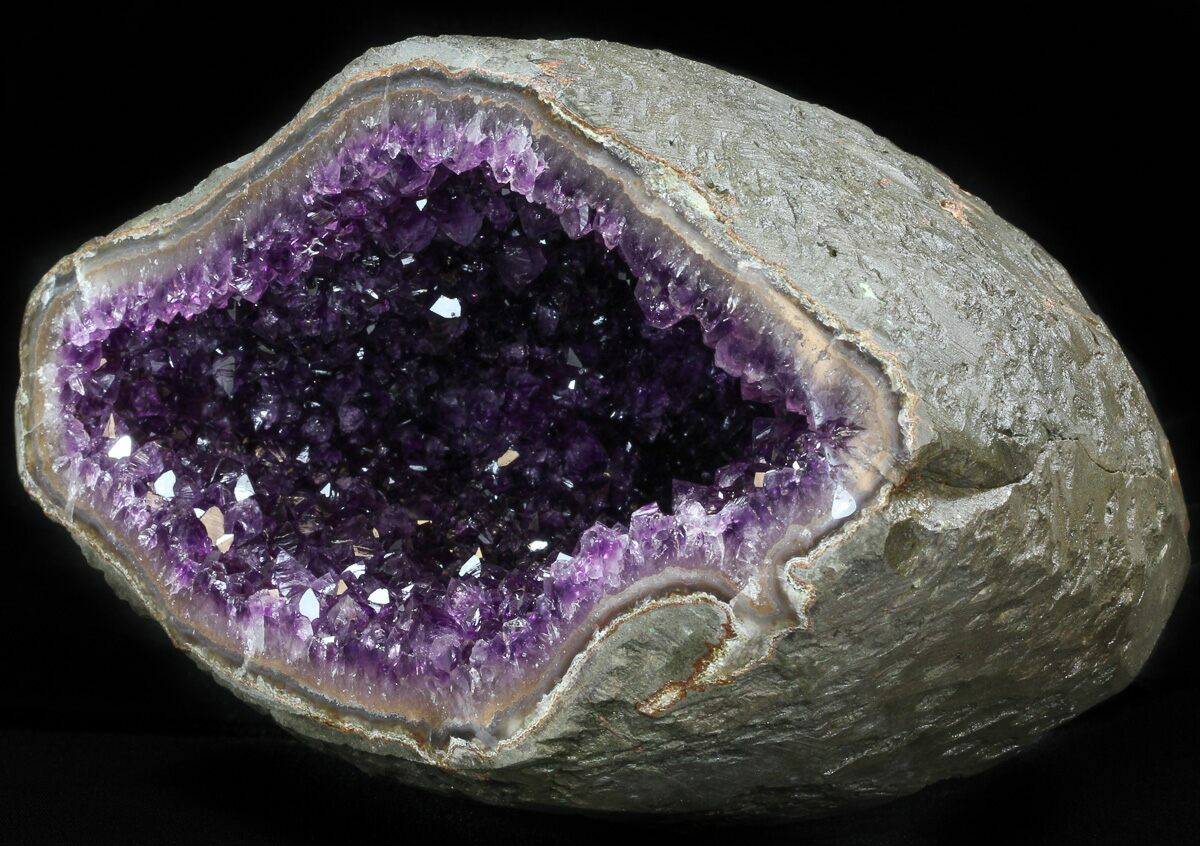 It weighs 11 lbs and is full of sparkling, light purple amethyst crystals s...